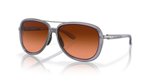Sunglasses with brown gradient lenses and gray frame on a white background. Oakley split time lilac sunglasses