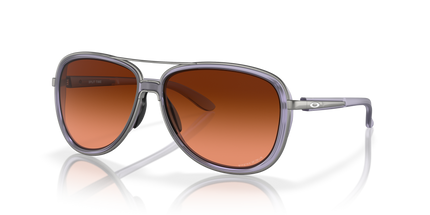 Sunglasses with brown gradient lenses and gray frame on a white background. Oakley split time lilac sunglasses