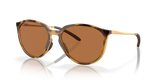 A pair of tortoise-patterned bronze polarized sunglasses with the Oakley brand logo on the side. Sielo oakley sunglasses