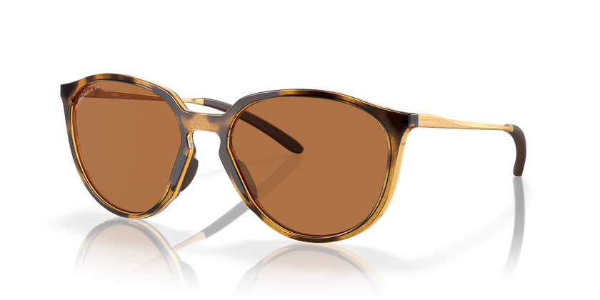 A pair of tortoise-patterned bronze polarized sunglasses with the Oakley brand logo on the side. Sielo oakley sunglasses