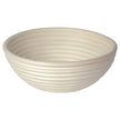 Round woven bread proofing basket on a white background